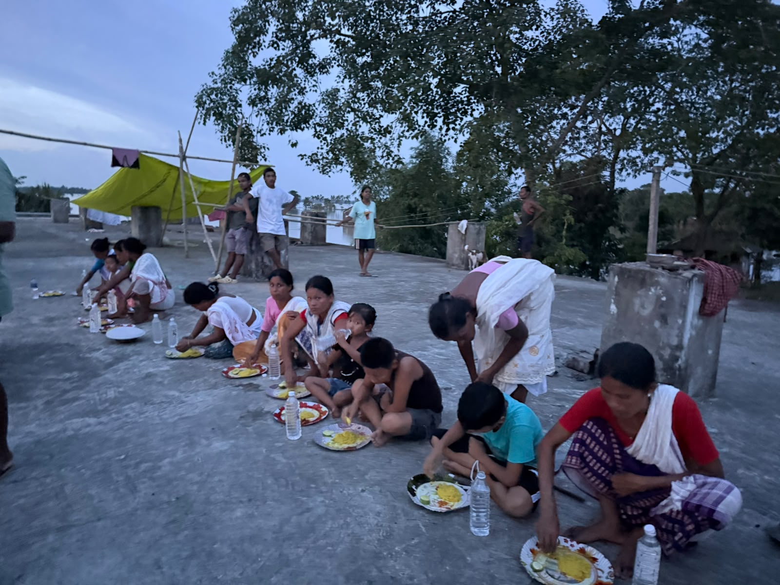 Community members sharing a meal during an outreach activity