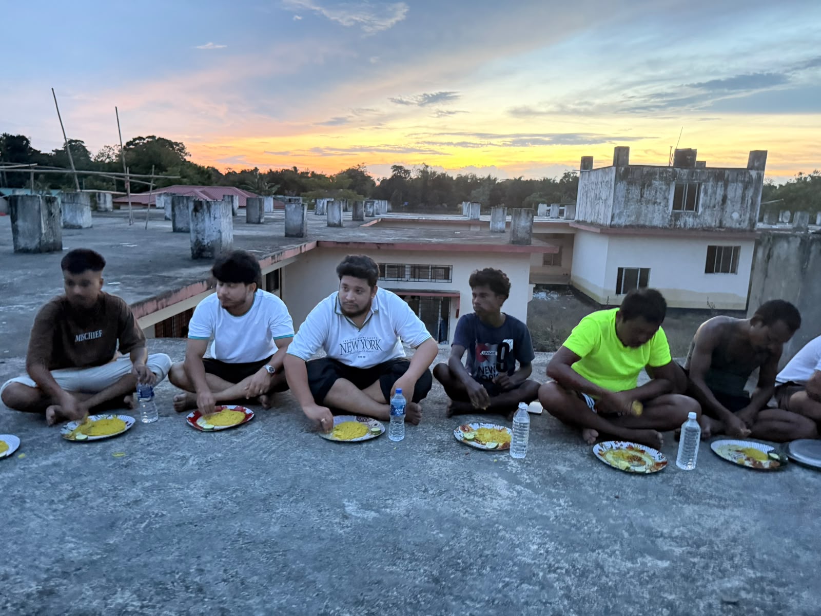Young volunteers eating together after community service